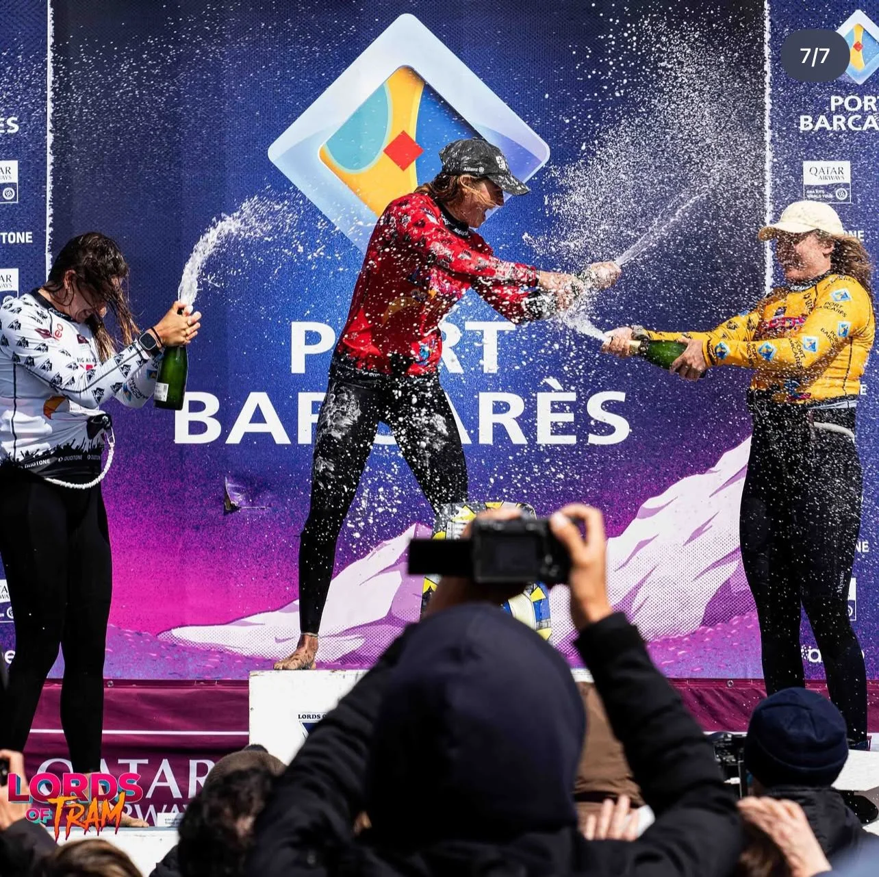 Kitesurfing athletes celebrating at a competition